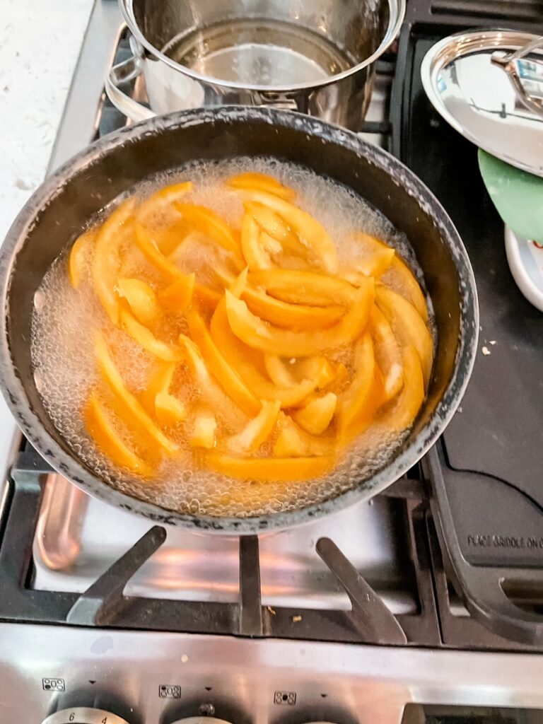 The grapefruit peels being blanched a pot for the Easy Candied Grapefruit Peel 