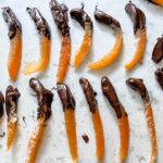 The Easy Candied Grapefruit Peel pieces half dipped in chocolate