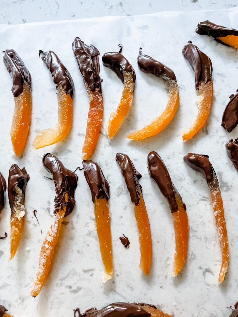 The Easy Candied Grapefruit Peel pieces half dipped in chocolate