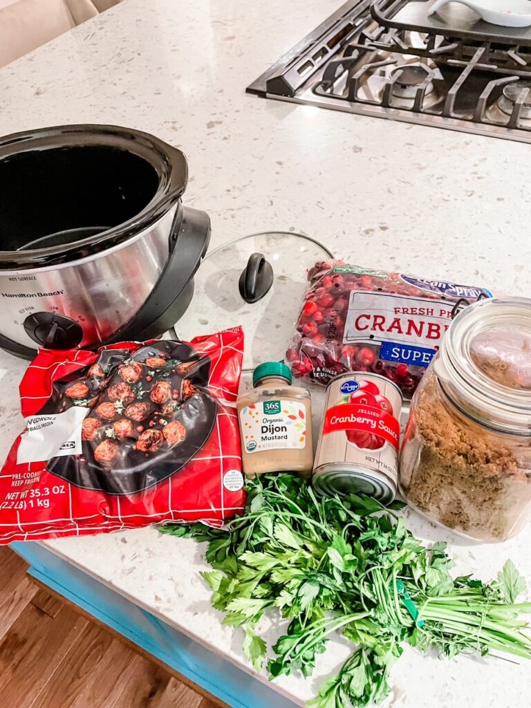 The ingredients for the Easy Cranberry Mustard Slow Cooker Meatballs – Just 4 Ingredients! laid out on a counter top