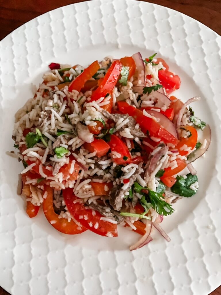 The plated Steak and Tomato salad