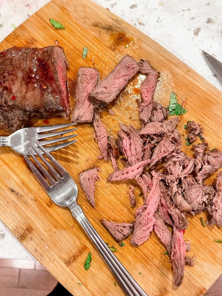 The cooked and sliced steak