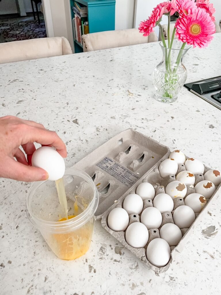 Separating the eggshells and yolk
