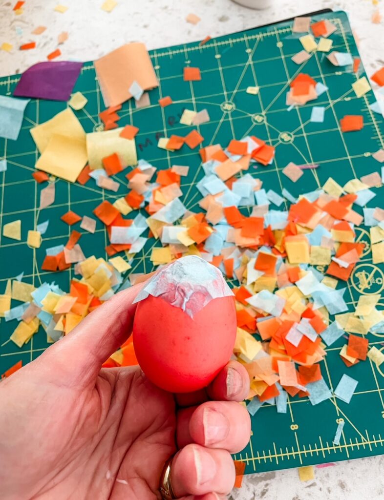 One of the DIY Confetti Easter Eggs being held up