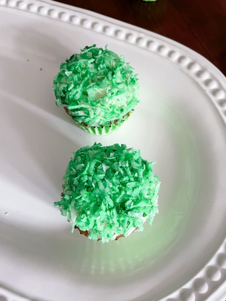 Two of the Pineapple Carrot Cupcakes decorated for St. Patrick's Day
