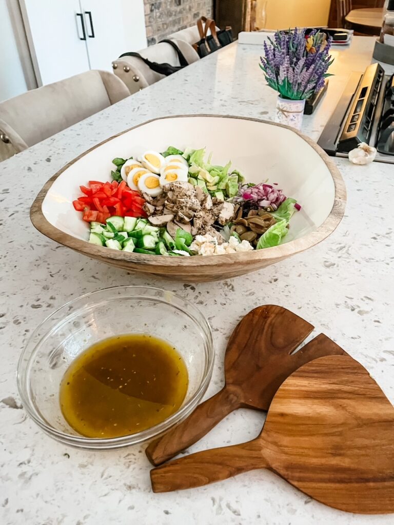 The finished Greek Inspired Chicken Cobb Salad and dressing