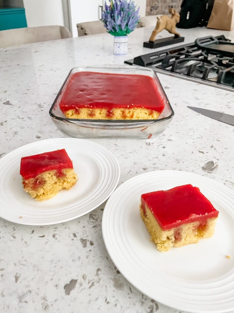 Strawberry Rhubarb Poke Cake sliced