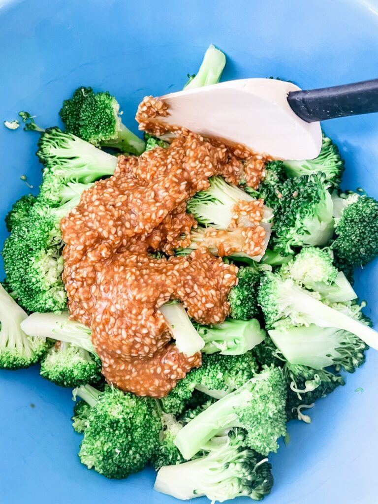 Tossing the broccoli in the low-sodium sesame dressing