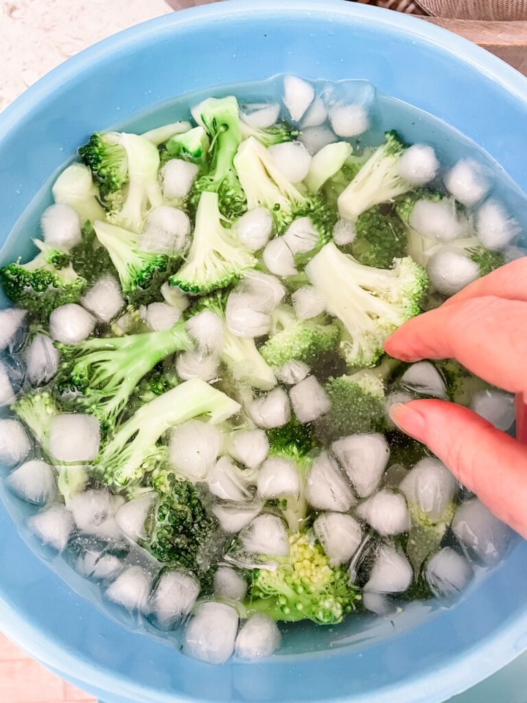 Dunking the blanched florets in an ice bath