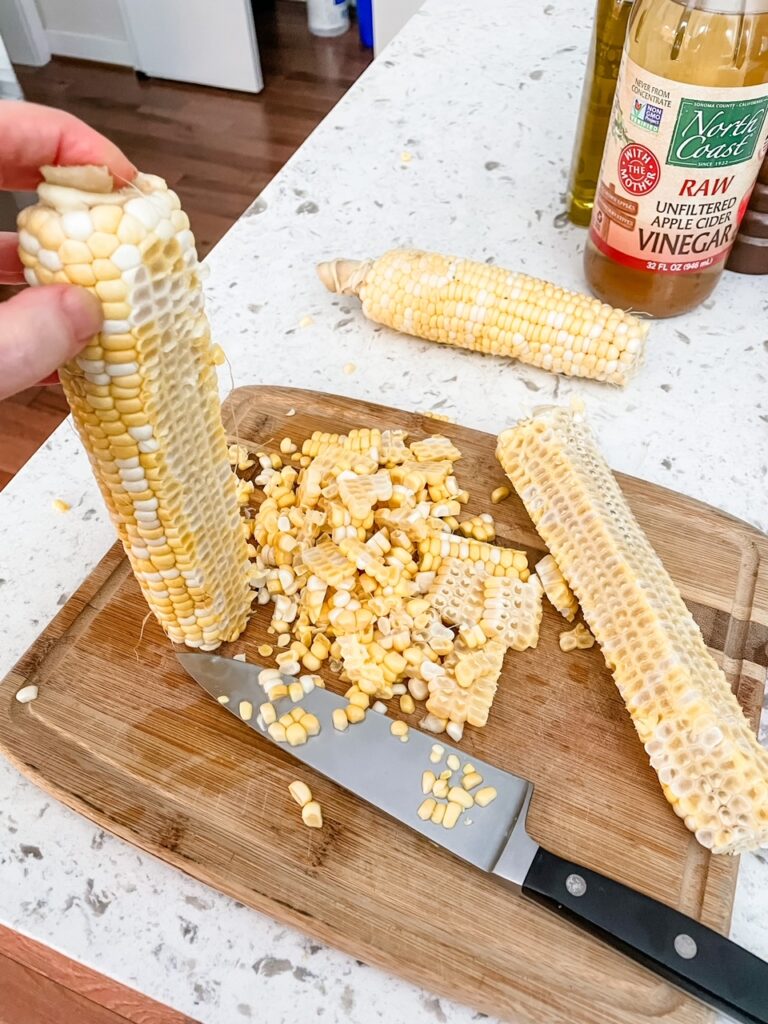 A corn cub having its kernels sliced from it