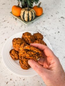 Marie holding up one of the Pumpkin Morning Glory Muffins