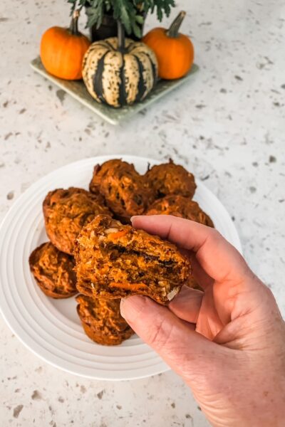 Marie holding up one of the Pumpkin Morning Glory Muffins