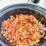 The finished Slow Cooker Baked Beans in a slow cooker