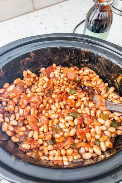 The finished Slow Cooker Baked Beans in a slow cooker