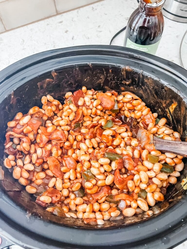 The finished Slow Cooker Baked Beans in a slow cooker