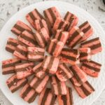 The finished Chocolate Peppermint Crunch Ribbon Cookies stacked on a plate