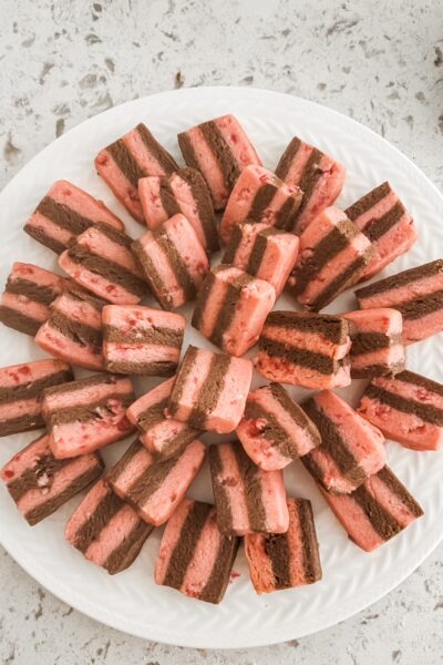 The finished Chocolate Peppermint Crunch Ribbon Cookies stacked on a plate