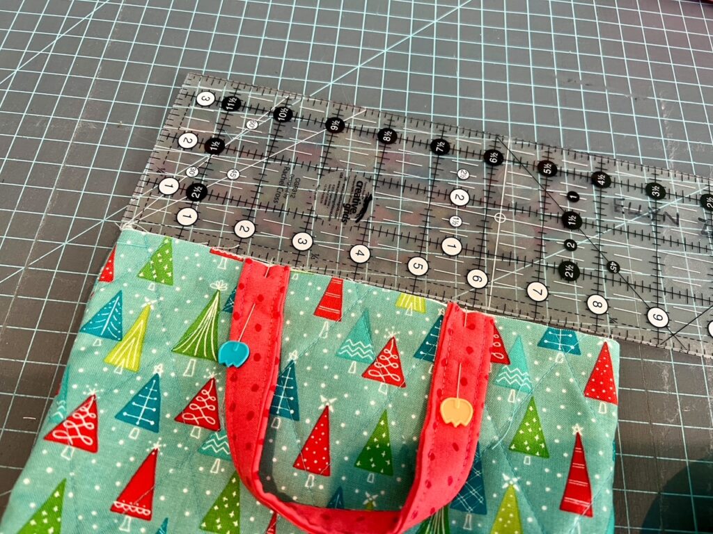 The straps pinned to the main portion of the DIY Fabric Gift Bags