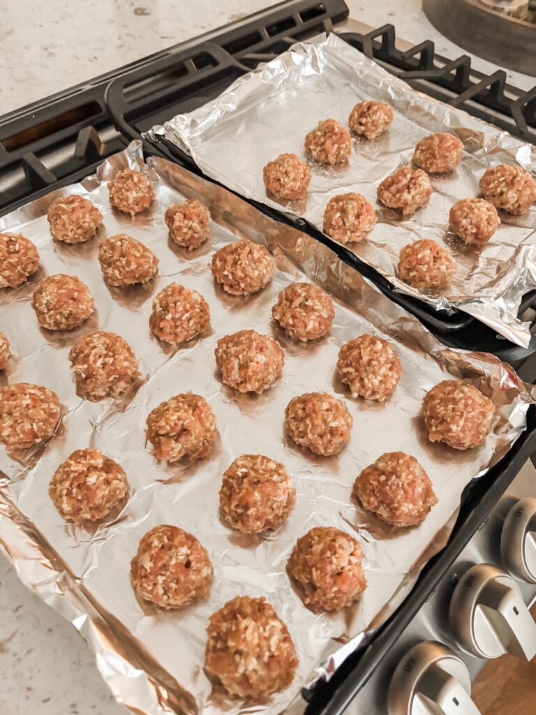 The prepped meatballs set on a tray