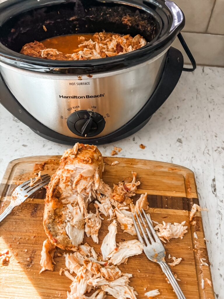 Pulling apart the chicken for the Slow Cooker Chicken Tinga 