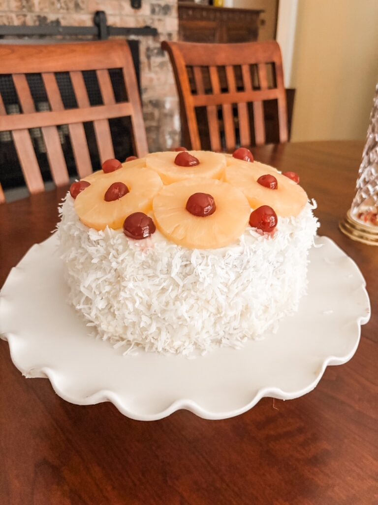The finished and decorated Coconut Cake with Pineapple Filling