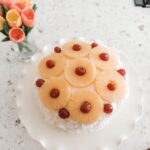 The finished and decorated Coconut Cake with Pineapple Filling