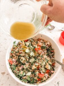 The dressing being poured into the No Cook Tabouli