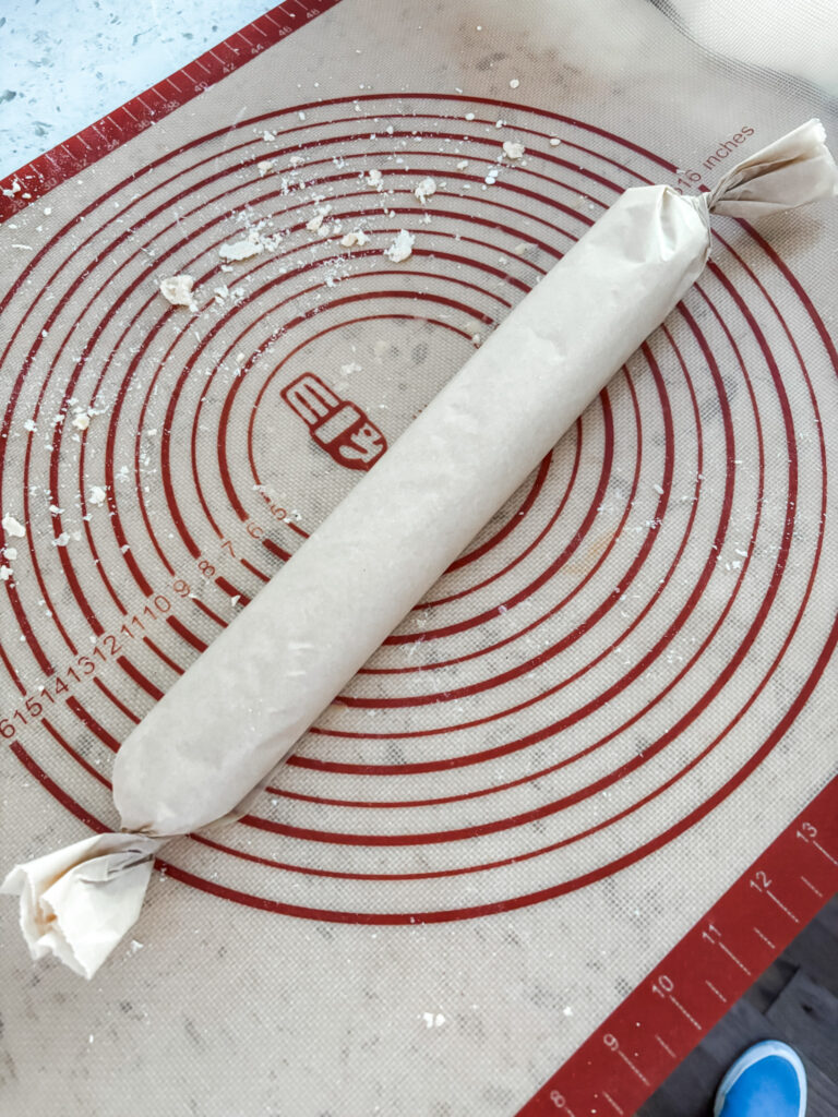 The wafer dough wrapped in parchment paper to be chilled