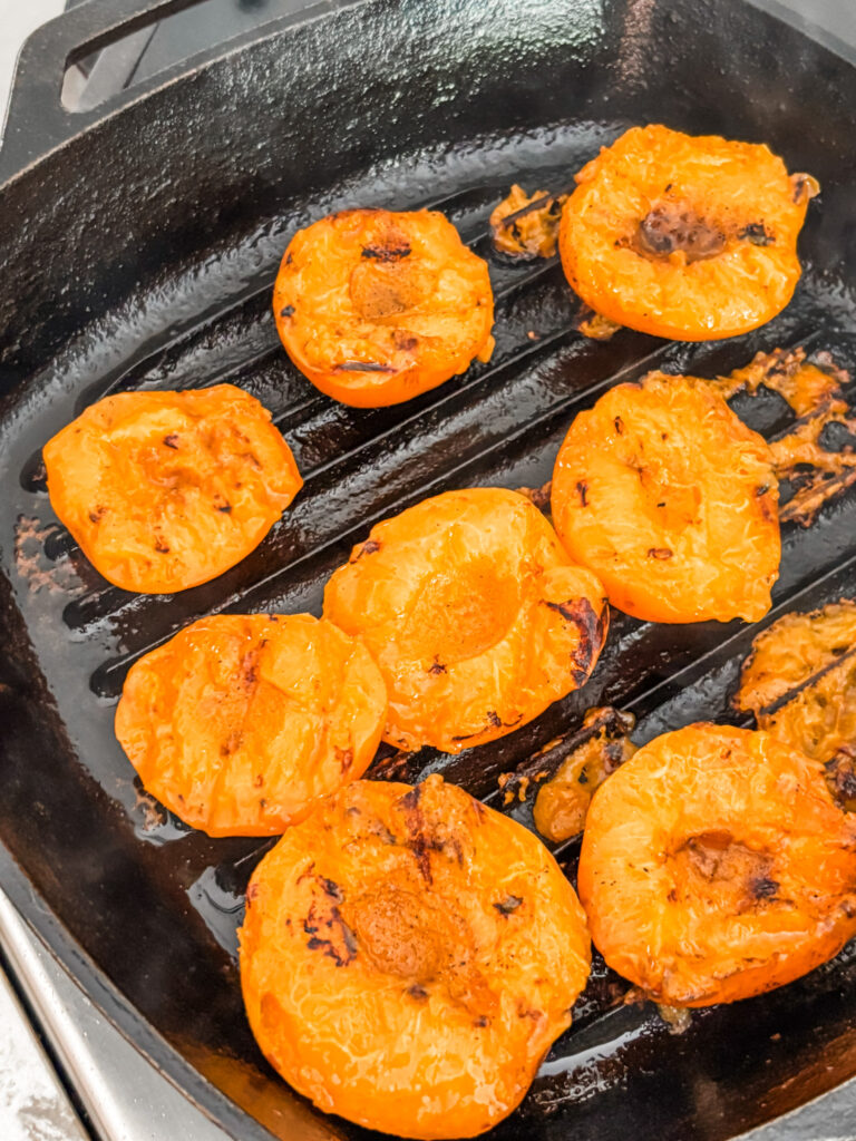 The apricots being grilled