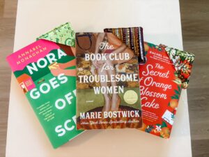 The finished Easy Sew Corner Bookmarks on a few books