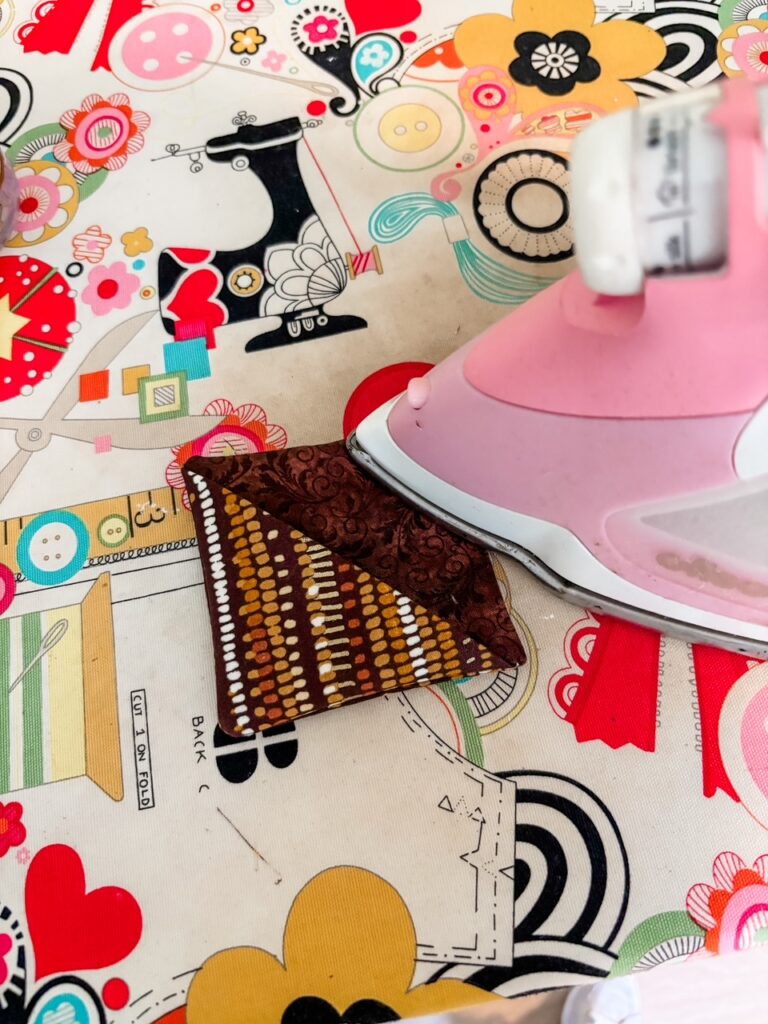 Marie giving the fabric piece and interface a quick press