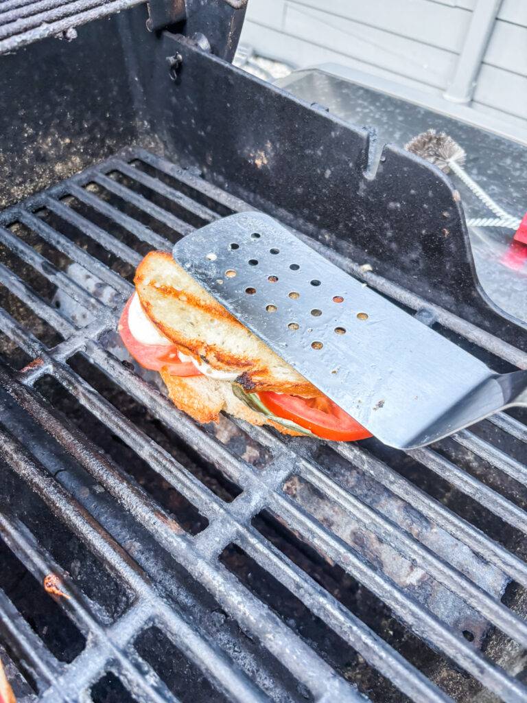 Turning and pressing the sandwich on the grill