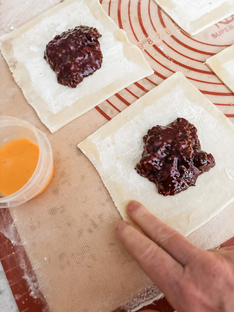 The filling placed on the slices of puff pastry