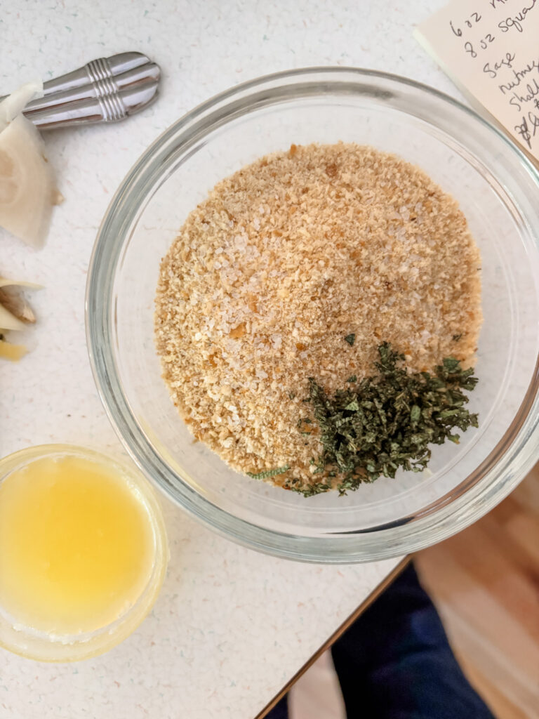 The breadcrumb topping mixture, prior to being mixed, in a bowl