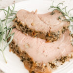 Two slices of the Pork Sirloin Roast with springs or rosemary