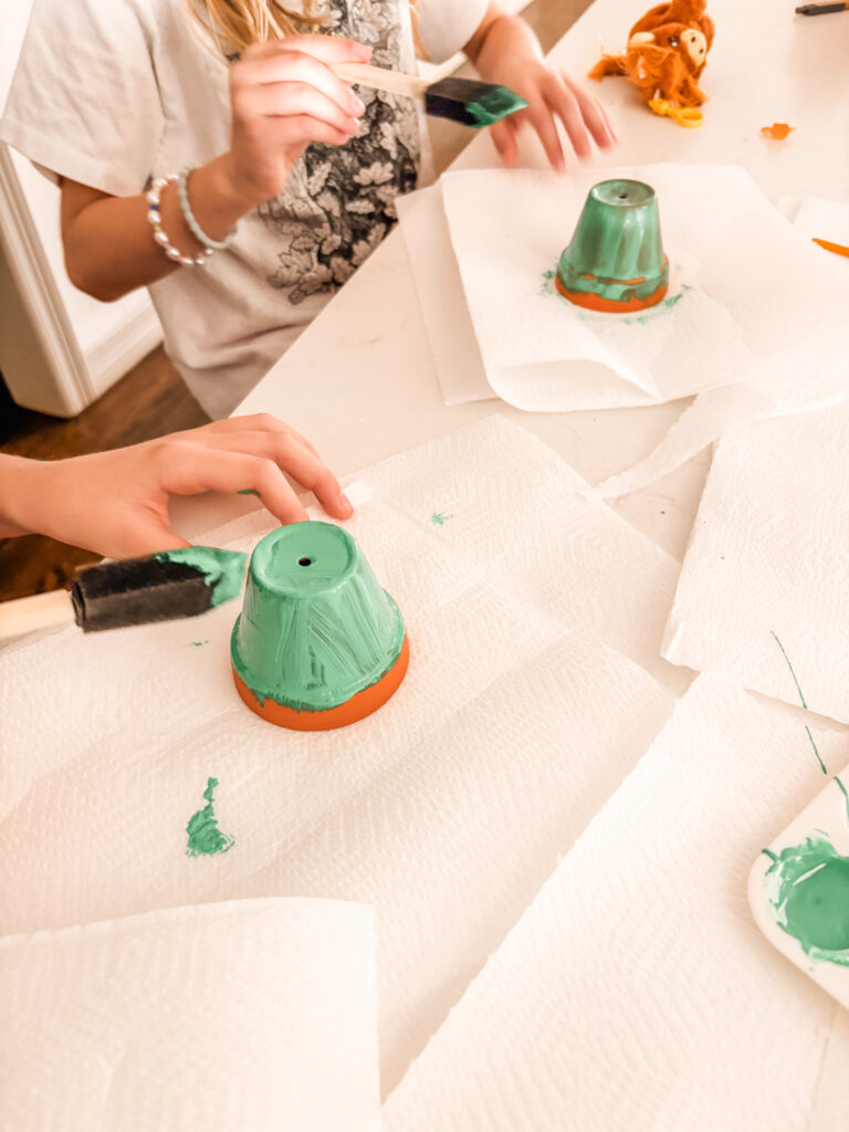 Painting the entire clay pot green