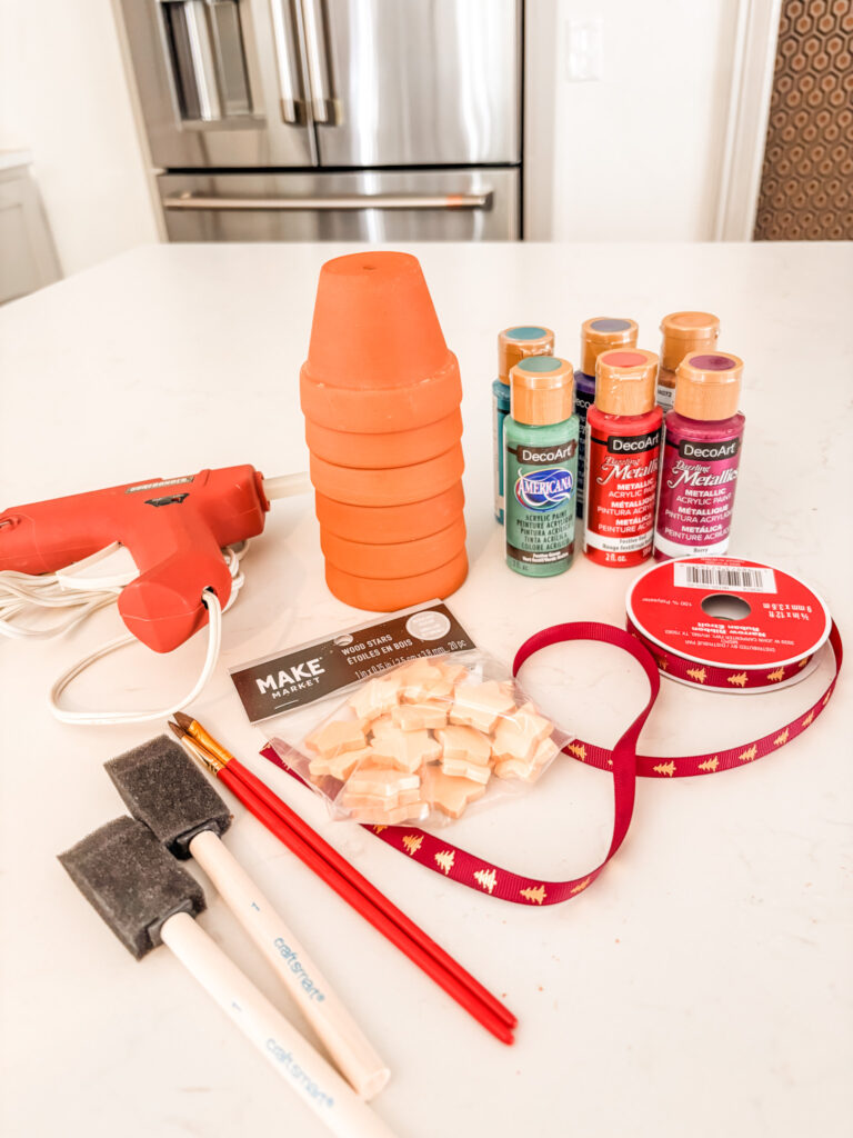 The supplied needed for the Clay Pot Ornaments on a counter