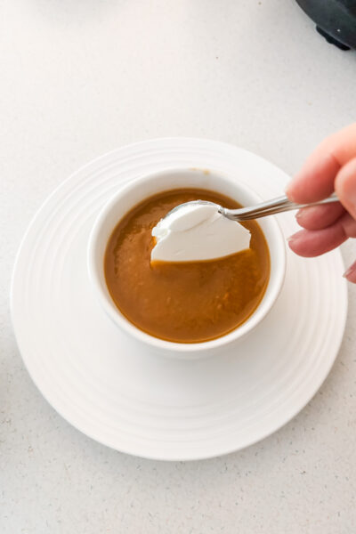 Topping the soup with a dollop of the Greek yogurt