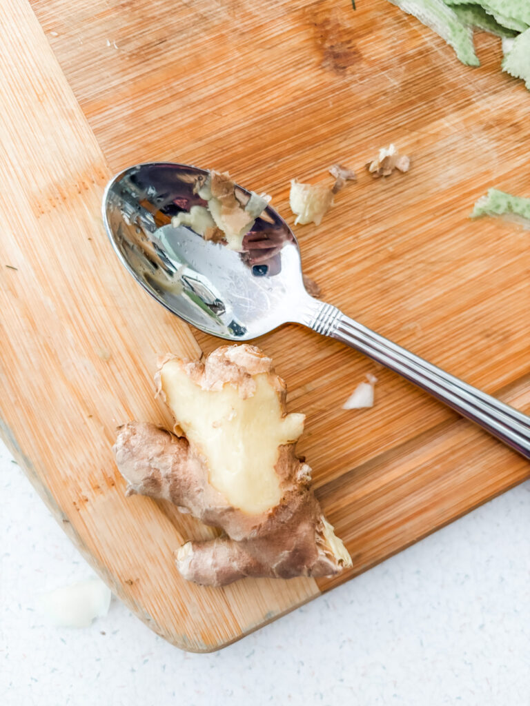 A piece of ginger that has been scraped with a spoon