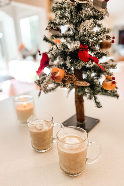 The finished Eggnog with Leftover Egg Yolks on a counter in front of a Christmas tree