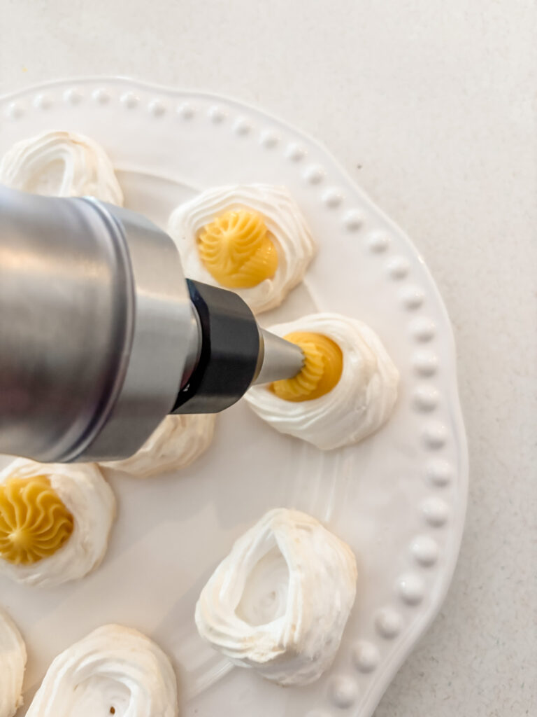 The lemon curd being piped