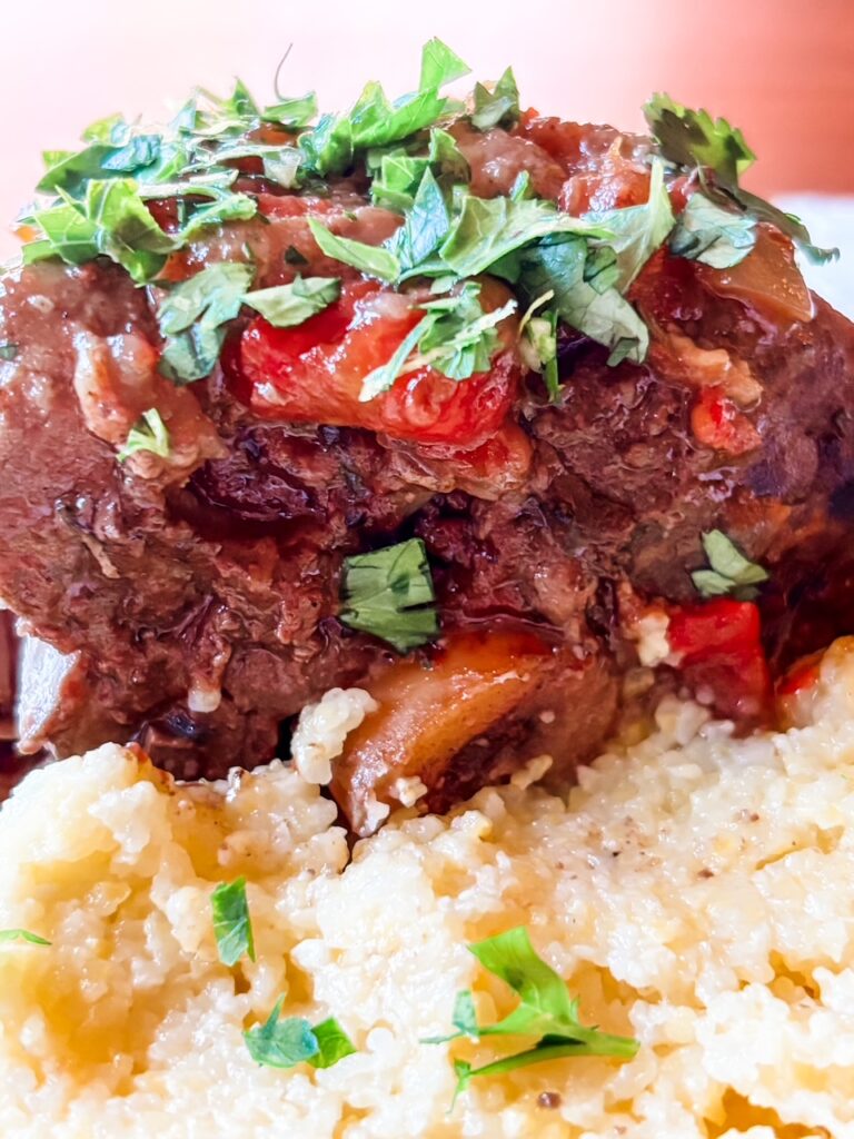 The finished Pork Osso Bucco Recipe served on top of polenta