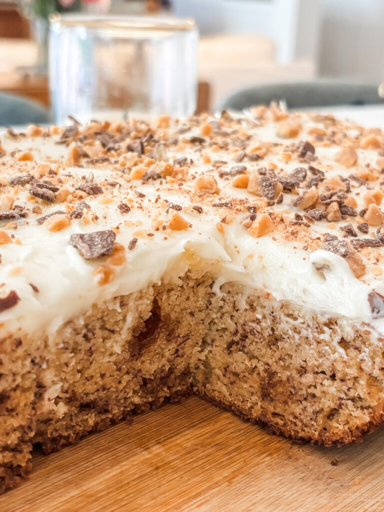The finished banoffee cake with a slice taken out of it