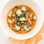The bowl of chili with toppings and chips