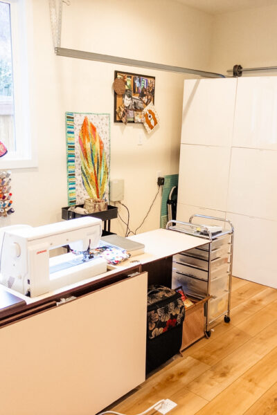 Marie's finished garage-to-sewing-room conversion, showing the main sewing desk space
