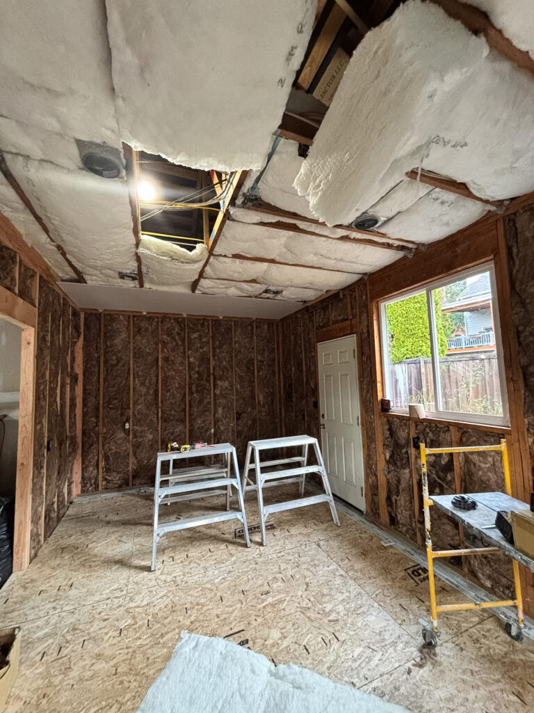 The "before" of the garage with no renovations - unfinished and cluttered with tools for the renovation