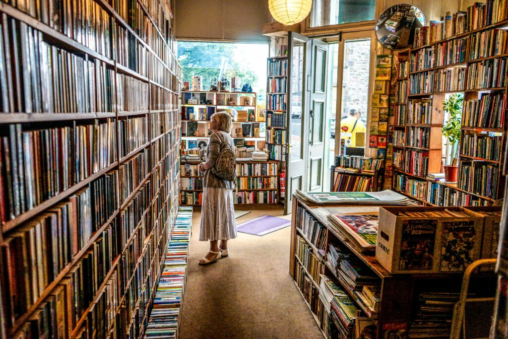 A woman in the interior of a bookstore