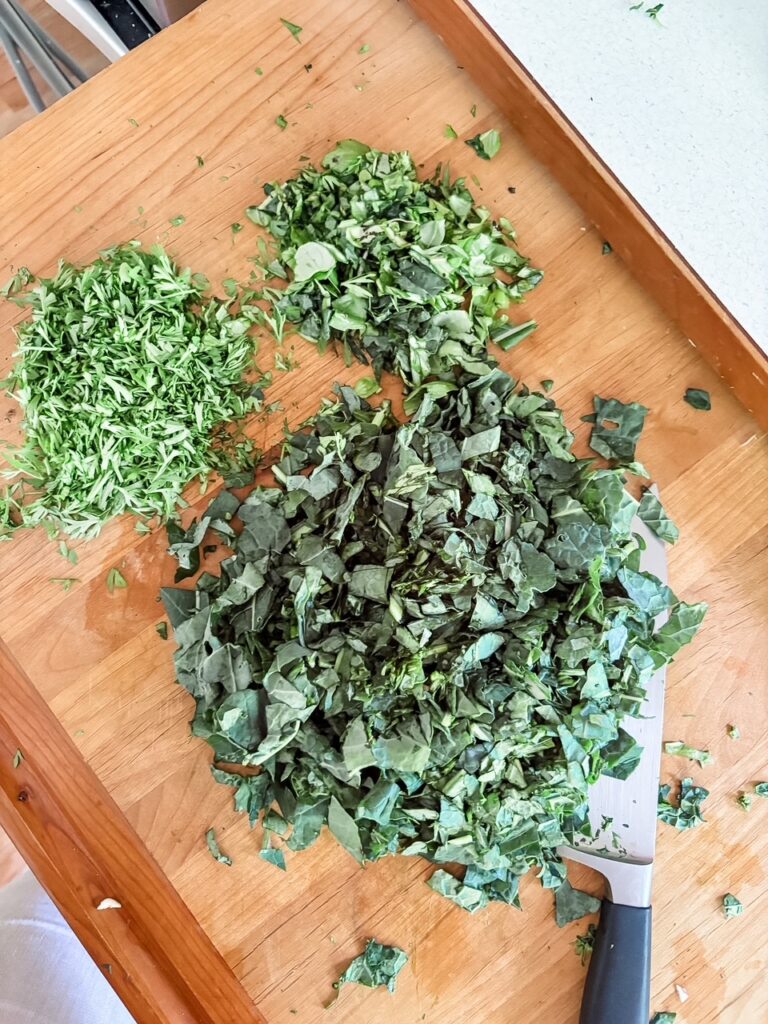 The chopped carrot tops and kale 
